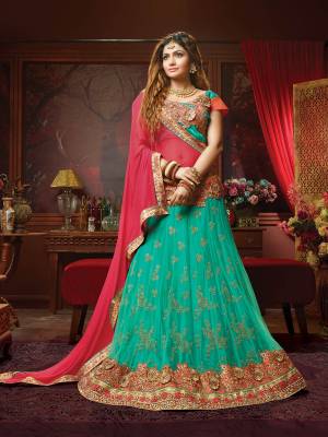Look Beautiful In This Heavy Designer Lehenga Choli In Sea Green Color Paired With Contrasting Crimson Red Colored Dupatta. This Pretty Lehenga Choli Is Perfect For Bridesmaid Which Is Beautified With Heavy And Attractive Embroidery. Its Blouse Is Art Silk Fabricated Paired With Jacquard Net Lehenga And Chiffon Fabricated Dupatta. 