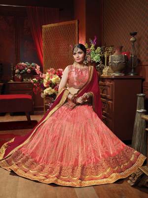 Rich And Elegant Looking Heavy Designer Lehenga Choli Is Here In Peach Color Paired With Contrasting Maroon Colored Dupatta. Its Blouse Is Fabricated On Art Silk Paired With Jacquard Net Lehenga And Chiffon Fabricated Dupatta. Buy This Designer Piece Now.