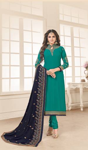 Go with The Shades Of Blue With This Designer Straight Cut Suit In Turquoise Blue Color Paired With Navy Blue Colored Dupatta. Its Top And Dupatta Are Fabricated On Georgette Paired With Santoon Bottom. Its Heavy Embroidery Over The Top And Dupatta Is Giving This Dress An Enhanced Look. 