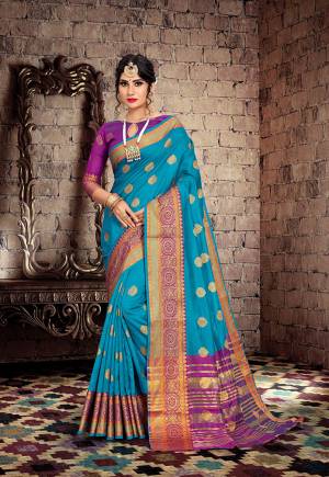 Here Is A Very Pretty Designer Saree For The Upcoming Festive And Wedding Season. Grab This Pretty Saree In Blue Color Paired With Contrasting Purple Colored Blouse. This Saree Is Fabricated On Cotton Silk Paired With Art Silk Fabricated Blouse. Buy This Saree Now.