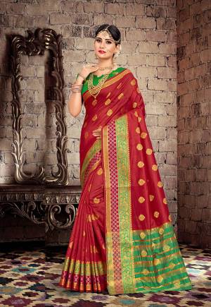 Celebrate This Festive Season With Beauty And Comfort With This Designer Saree In Maroon Color Paired With Contrasting Green Colored Blouse. This Saree Is Fabricated On Cotton Silk Paired With Art Silk Fabricated Blouse. 