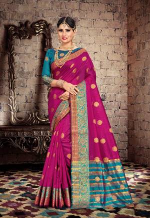 Celebrate This Festive Season With Beauty And Comfort With This Designer Saree In Magenta Pink Color Paired With Contrasting Blue Colored Blouse. This Saree Is Fabricated On Cotton Silk Paired With Art Silk Fabricated Blouse. 