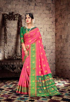 Here Is A Very Pretty Designer Saree For The Upcoming Festive And Wedding Season. Grab This Pretty Saree In Pink Color Paired With Contrasting Green Colored Blouse. This Saree Is Fabricated On Cotton Silk Paired With Art Silk Fabricated Blouse. Buy This Saree Now.