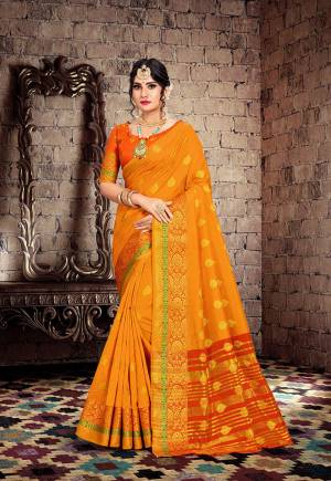 Celebrate This Festive Season With Beauty And Comfort With This Designer Saree In Musturd Yellow Color Paired With Contrasting Orange Colored Blouse. This Saree Is Fabricated On Cotton Silk Paired With Art Silk Fabricated Blouse. 