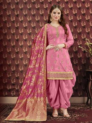Celebrate This Festive Season Wearing This Designer Suit In Dark Pink Color. Its Pretty Embroidered Top Is Fabricated On Art Silk Paired With Santoon Bottom And Jacquard Silk Fabricated Dupatta. It Is Beautified With Attractive Gota Patti Work. Buy Now.