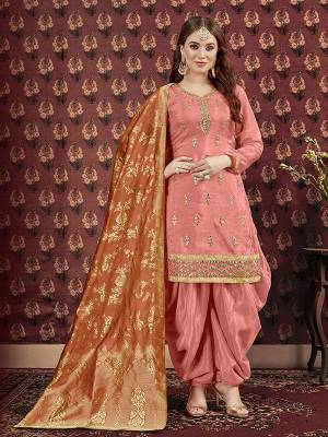 Celebrate This Festive Season Wearing This Designer Suit In Peach Color. Its Pretty Embroidered Top Is Fabricated On Art Silk Paired With Santoon Bottom And Jacquard Silk Fabricated Dupatta. It Is Beautified With Attractive Gota Patti Work. Buy Now.