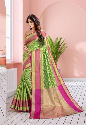 Add This Beautiful Designer Silk Based Saree In Green Color Paired With Gold & Pink Colored Blouse. This Saree Is Fabricated On Banarasi Art Silk Paired With Art Silk Fabricated Blouse. It IS Beautified With Heavy Attractive Weave Which Earn You Lots Of Compliment From Onlookers. 