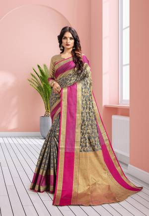 Add This Beautiful Designer Silk Based Saree In Grey Color Paired With Golden Colored Blouse. This Saree Is Fabricated On Banarasi Art Silk Paired With Art Silk Fabricated Blouse. It IS Beautified With Heavy Attractive Weave Which Earn You Lots Of Compliment From Onlookers. 