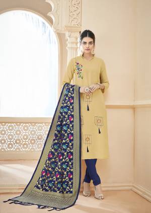 Rich And Elegant Looking Designer Straight Suit Is Here In Cream Color Paired With Contrasting Navy Blue Colored Bottom And Dupatta. Its Top Is Fabricated On Cotton Slub Paired With Cotton Bottom And Banarasi Jacquard Fabricated Dupatta. 