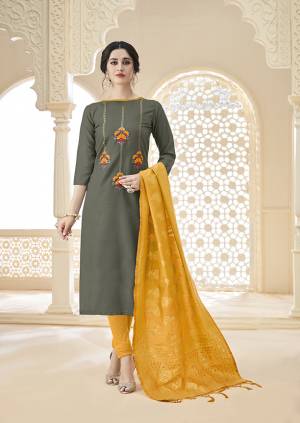 Flaunt Your Rich And Elegant Taste Wearing This Simple And Elegant Looking Designer Straight Suit In Dark Grey Colored Top Paired With Musturd Yellow Colored Bottom And Dupatta. Its Top And Bottom Are Cotton Based Paired With Banarasi Jacquard Fabricated Dupatta. Buy Now.