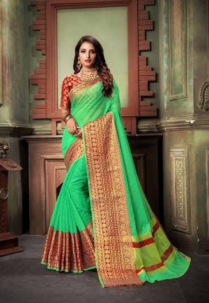 Here Is A Very Pretty Designer Saree For The Upcoming Festive And?Wedding Season. Grab This Pretty Saree In Green Color Paired With Contrasting Red Colored Blouse. This Saree Is Fabricated On Cotton Silk Paired With Art Silk Fabricated Blouse. Buy This Saree Now