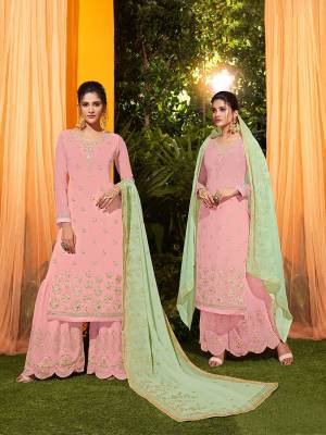 Look Pretty In This Lovely Designer Piece With This Suit In Pink Colored Top And Bottom Paired With Contrasting Pastel Green Colored Dupatta. This all Over Suit Is Fabricated On Georgette Beautified With Attractive Embroidery. Buy Now.