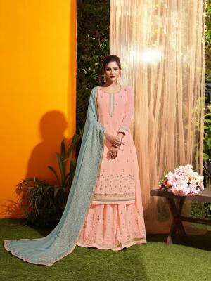 A Must Have Shade In Every Womens Wardrobe Is Here With This Designer Suit In Light Peach Colored Top And Bottom Paired With Contrasting Grey Colored Dupatta. This Whole Dress Is Georgette Based Beautified Attractive Embroidery Giving The Suit An Attractive Look. 