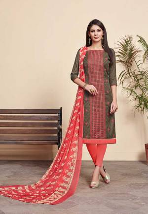 For Your Casual Wear, Grab This Pretty Dress Material And Get This Stitched As Per Your Desired Fit And Comfort. Its Top Is In Brown Color Paired With Contrasting Crimson Red Colored Bottom And Dupatta. Its Top Is Fabricated On Jacquard Cotton Silk Paired With Cotton Bottom And Chiffon Fabricated Dupatta. 