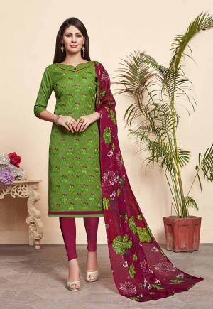 For Your Casual Wear, Grab This Pretty Dress Material And Get This Stitched As Per Your Desired Fit And Comfort. Its Top Is In Green Color Paired With Contrasting Crimson Maroon Colored Bottom And Dupatta. Its Top Is Fabricated On Jacquard Cotton Silk Paired With Cotton Bottom And Chiffon Fabricated Dupatta. 