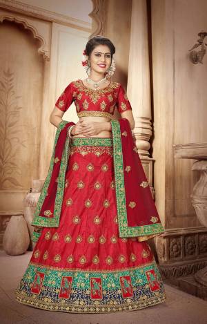 Adorn The Pretty Angelic Look Wearing This Designer Lehenga Choli In Red Color Paired With Maroon Colored Dupatta, This Lehenga Choli Is Fabricated On Art Silk Paired With Net Fabricated Dupatta. 