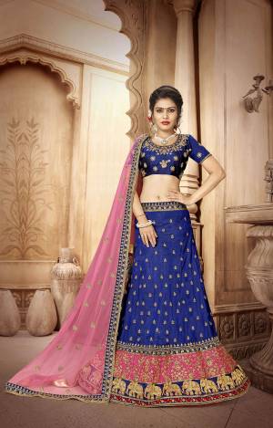 Look Pretty In This Designer Lehenga Choli In Blue Color Paired With Contrasting Pink Colored Dupatta. Its Blouse And Lehenga Are Fabricated On Art Silk Paired With Net Fabricated Dupatta. It Is Light Weight And Easy To Carry All Day Long. 