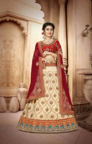 For A Proper Traditional Look, Here Is An Evergreen Color Pallete Designer Lehenga Choli In Red Colored Blouse Paired With Cream Colored Lehenga And Maroon Colored Dupatta. This Lehenga Choli Is Fabricated On Art Silk Paired With Net Fabricated Dupatta. 