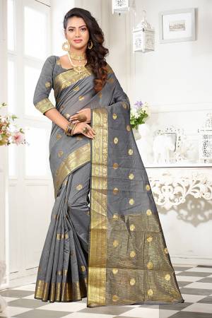 Celebrate This Festive Season With Beauty And Comfort Wearing This Designer Saree In Grey Color Paired With Grey Colored Blouse. This Saree And Blouse Are Fabricated On Art Cotton Silk Beautified With Weave. It Is Light Weight And easy To Drape. 
