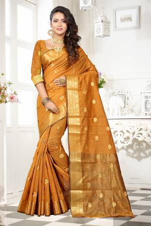 Grab This Designer Rich And Elegant Looking Saree In Occur Yellow Color Paired With Occur Yellow Colored Blouse. This Saree And Blouse Are Fabricated On Art Cotton Silk Beautified With Weave Butti And Lace Border. Buy This Saree Now.