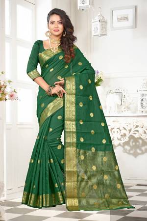 Celebrate This Festive Season With Beauty And Comfort Wearing This Designer Saree In Dark Green Color Paired With Dark Green Colored Blouse. This Saree And Blouse Are Fabricated On Art Cotton Silk Beautified With Weave. It Is Light Weight And easy To Drape. 