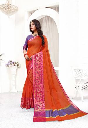 Look Pretty In This Simple And Elegant Looking Designer Saree In Orange Color Paired With Violet Colored Blouse. This Saree And Blouse are Fabricated On Cotton Silk Beautified With Weave Over Lace Border. 