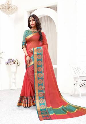 This Festive Season Be The Most Pretty And Elegant Of All Wearing This Saree In Red Color Paired With Contrasting Teal Blue Colored Blouse. This Saree And Blouse Are Fabricated On Cotton Silk Beautified With Weaved Lace Border. 