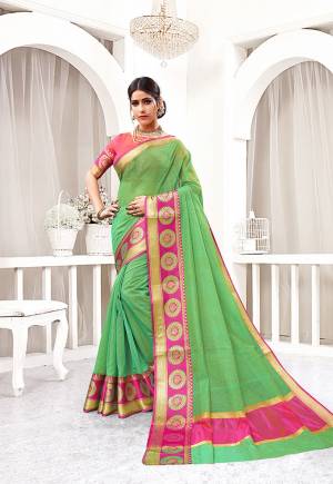 Look Pretty In This Simple And Elegant Looking Designer Saree In Green Color Paired With Pink Colored Blouse. This Saree And Blouse are Fabricated On Cotton Silk Beautified With Weave Over Lace Border. 