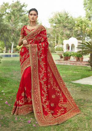 Adorn The Pretty Angelic Look In This Heavy Designer Saree In Attractive Red Color Paired With Red Colored Blouse. This Saree Is Fabricated On Silk Georgette Paired With Art Silk Fabricated Blouse. This Saree And Blouse are Beautified With Heavy Embroidery Giving It An Attractive Look.