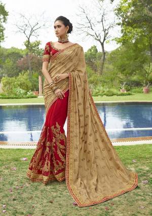 Evergreen Combination Is Here With ThisHeavy Designer Saree In Beige And Red Color Paired With Red Colored Blouse. This Saree IS Fabricated On Soft Silk And Net Paired With Art Silk Fabricated Blouse. It Is Beautified With Heavy Embroidery Which Will Also Give A Look Like Never Before.