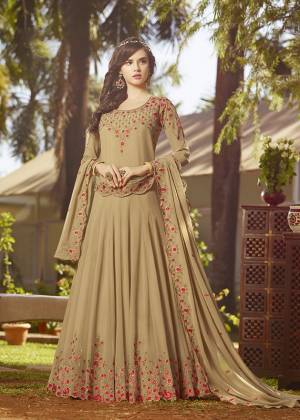 Simple And Elegant Looking Designer Floor Length Suit Is Here In Beige Color Paired With Beige Colored Bottom And Dupatta. Its Top And Dupatta Are Georgette Fabricated Beautified With Contrasting Embroidery Paired With Santoon Bottom. It Is Light In Weight And Easy To Carry All Day Long. 