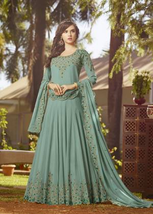 Simple And Elegant Looking Designer Floor Length Suit Is Here In Steel Blue Color Paired With Steel Blue Colored Bottom And Dupatta. Its Top And Dupatta Are Georgette Fabricated Beautified With Contrasting Embroidery Paired With Santoon Bottom. It Is Light In Weight And Easy To Carry All Day Long. 
