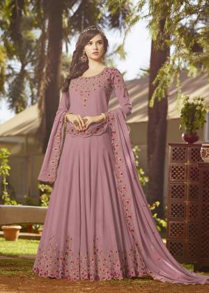 Simple And Elegant Looking Designer Floor Length Suit Is Here In Light Purple Color Paired With Light Purple Colored Bottom And Dupatta. Its Top And Dupatta Are Georgette Fabricated Beautified With Contrasting Embroidery Paired With Santoon Bottom. It Is Light In Weight And Easy To Carry All Day Long. 