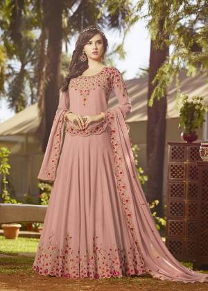 Simple And Elegant Looking Designer Floor Length Suit Is Here In Baby Pink Color Paired With Baby Pink Colored Bottom And Dupatta. Its Top And Dupatta Are Georgette Fabricated Beautified With Contrasting Embroidery Paired With Santoon Bottom. It Is Light In Weight And Easy To Carry All Day Long. 