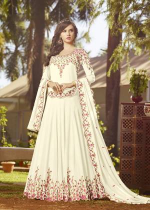 Simple And Elegant Looking Designer Floor Length Suit Is Here In White Color Paired With White Colored Bottom And Dupatta. Its Top And Dupatta Are Georgette Fabricated Beautified With Contrasting Embroidery Paired With Santoon Bottom. It Is Light In Weight And Easy To Carry All Day Long. 