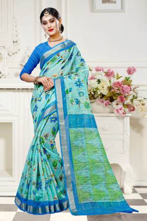 Simple Saree Is Here For Your Casual Wear In Light Blue Color Paired With Blue Colored Blouse. This Saree And Blouse are Fabricated On Cotton Silk Beautified With Floral Prints All Over. 