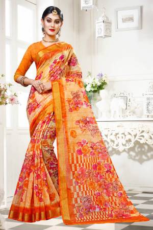 Simple Saree Is Here For Your Casual Wear In Orange Color Paired With Orange Colored Blouse. This Saree And Blouse are Fabricated On Cotton Silk Beautified With Floral Prints All Over. 