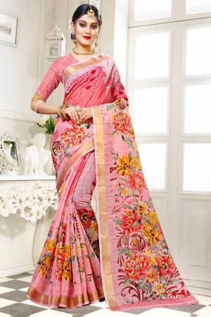 For Your Work Place And Comfort, Grab This Printed Saree In Pink Color Paired With Pink Colored Blouse. This Saree And Blouse are Fabricated On Cotton Silk Beautified With Floral Prints All Over It. Buy This Saree Now.