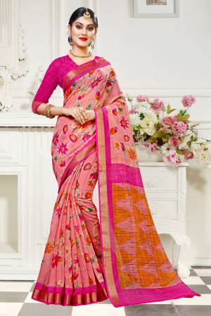 For Your Work Place And Comfort, Grab This Printed Saree In Pink Color Paired With Dark Pink Colored Blouse. This Saree And Blouse are Fabricated On Cotton Silk Beautified With Floral Prints All Over It. Buy This Saree Now.