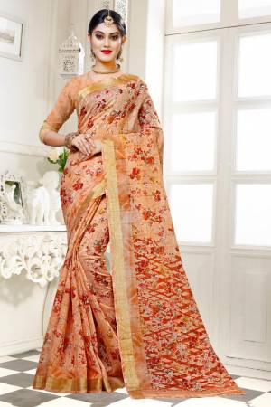 For Your Work Place And Comfort, Grab This Printed Saree In Light Brown Color Paired With Light Brown Colored Blouse. This Saree And Blouse are Fabricated On Cotton Silk Beautified With Floral Prints All Over It. Buy This Saree Now.