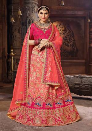Look Beautiful In This Designer Lehenga Choli At The Next Wedding You Attend In Dark Pink Color. Its Embroidered Blouse Is Silk Based Paired With Banarasi Jacquard Silk Lehenga And Net Fabricated Dupatta. Also It Is Light Weight And Easy To Carry Throughout The Gala.