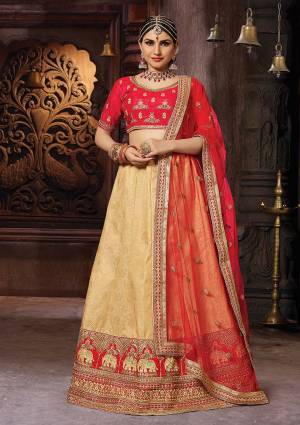 Evergreen Traditional Color Pallete Is Here With This Designer Lehenga Choli In Red And Beige Color. Its Embroidered Blouse Is Fabricated On Art Silk Paired With Banarasi Jacquard Silk Lehenga Beautified With Weave And Embroidery Paired With Net Fabricated Dupatta. 