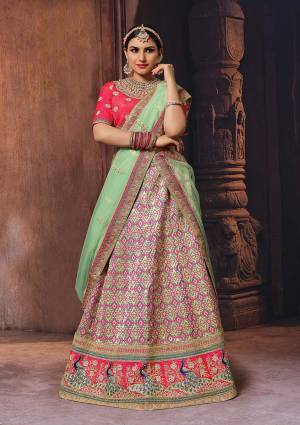 You Will Definitely Earn Lots Of Compliments Wearing This Designer Colorful Lehenga Choli In Dark Pink Colored Blouse Paired With Multi Colored Lehenga And Pastel Green Colored Dupatta. Its Blouse Is Fabricated On Art Silk Paired With Banarasi Jacquard Silk Lehenga And Net Fabricated Dupatta. Buy This Lovely Designer Piece Now.