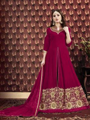 Add This Beautiful Designer Floor Length Suit To Your Wardrobe In Dark Magenta Pink Color. Its Top IS Fabricated On Georgette Beautified With Embroidery Over The Neck And Panel. Paired With Santoon Fabricated Bottom And Chiffon Dupatta. 