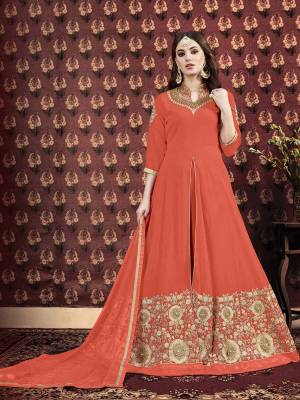 Add This Beautiful Designer Floor Length Suit To Your Wardrobe In Orange Color. Its Top IS Fabricated On Georgette Beautified With Embroidery Over The Neck And Panel. Paired With Santoon Fabricated Bottom And Chiffon Dupatta. 