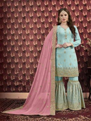 This Festive Season Look the Most Trendy And Prettiest Of All Wearing This Designer Sharara Suit In Sky Blue Colored Top And Bottom Paired With Contrasting Pink Colored Dupatta. Its Top And Dupatta are Georgette Based Paired With Santoon Fabricated Bottom. Buy Now.