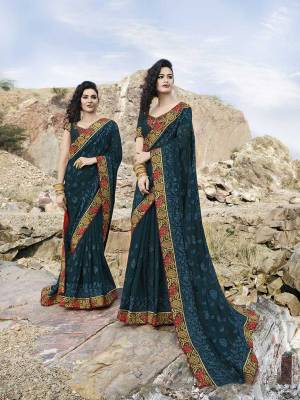 Catch All The Limelight Wearing This Heavy Designer Saree In Prussian Blue Color Paired With Prussian Blue Colored Blouse, This Heavy Tone To Tone Embroidered Saree Is Fabricated On Chiffon Paired With Art Silk Fabricated Blouse. Buy Now.
