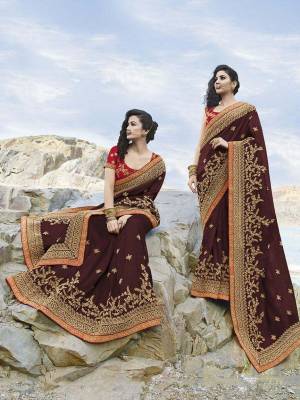 Trending Shade Is Here To Add Into Your Wardrobe With This Designer Saree In Maroon Color Paired With Contrasting Red Colored Blouse. This Saree Is Fabricated On Soft Silk Beautified With Heavy Embroidery Paired With Art Silk Fabricated Blouse. 