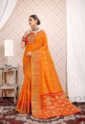 This Festive Season Be The Most Pretty And Elegant Of All Wearing?This Saree In Orange Color Paired With Orange Colored Blouse. This Saree And Blouse Are Fabricated On Cotton Silk Beautified With Weaved Lace Border.