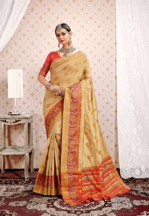 Flaunt Your Rich And Elegant Taste Wearing This Designer Silk based Saree In Beige Color Paired With Orange Colored Blouse. This Saree And Blouse Are fabricated On Cotton Silk Beautified With Attractive Weave. Buy This Saree Now.